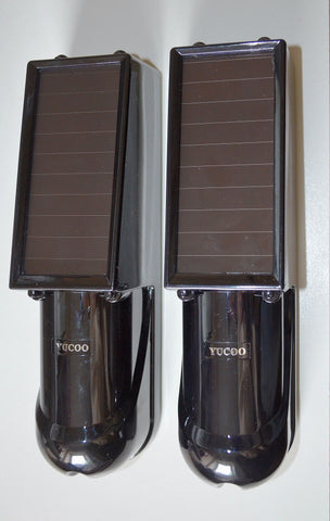 A pair of solar powered infrared beam detectors